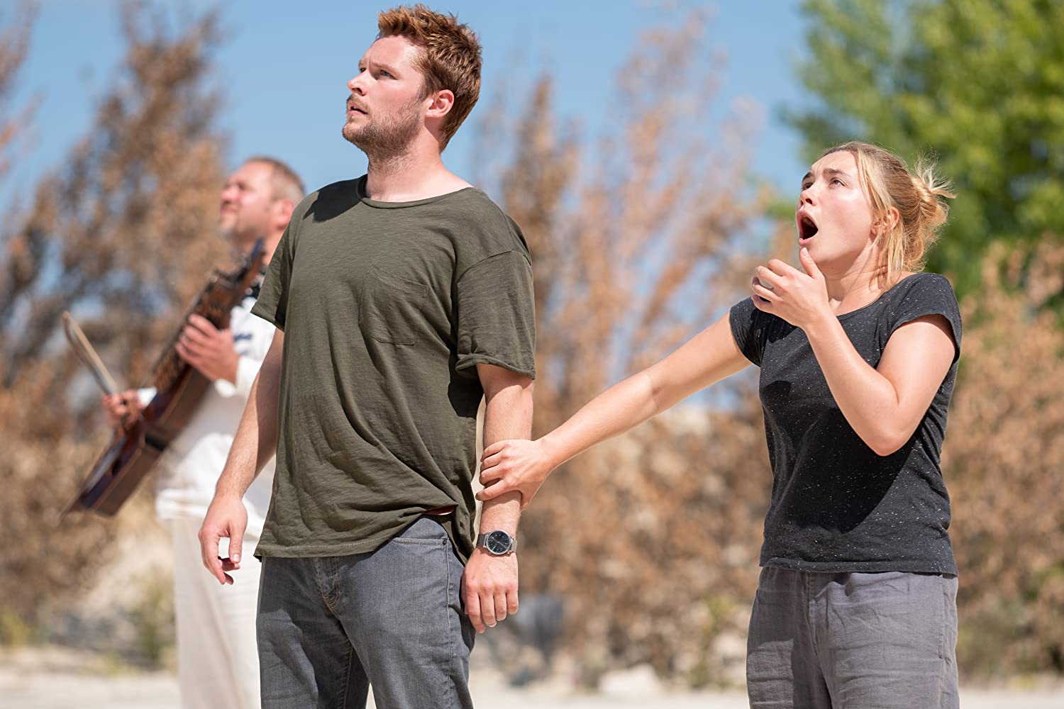 dani and christian shocked at the first ceremony at midsommar festival in sweden where two old people jump off a cliff and die